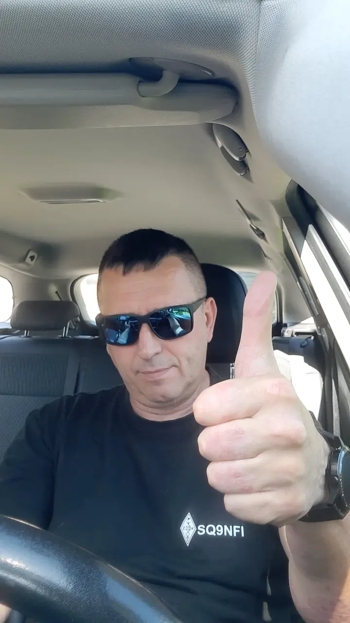 Somewhere on a trip, wearing a T-shirt with my callsign